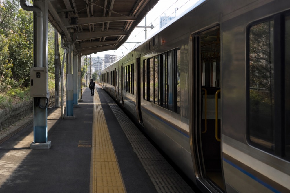 Shinkansen bullet train stopped at a station platform