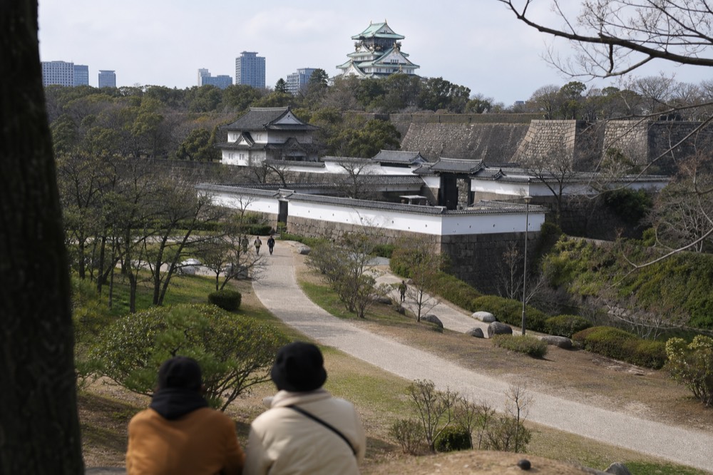 The ramparts and turrets of Nishinomaru Garden with the castle tower behind