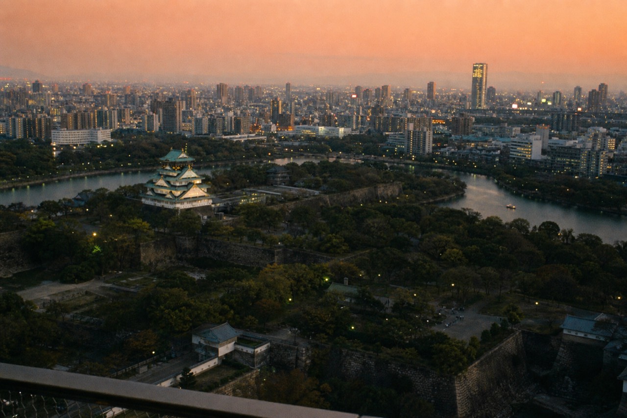 View over Osaka rooftops and rivers from a high observation deck at dusk