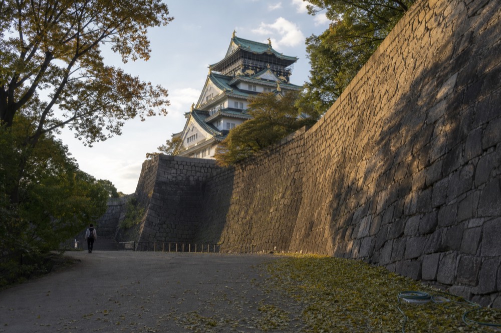 The castle tower among stone walls inside the inner courtyard